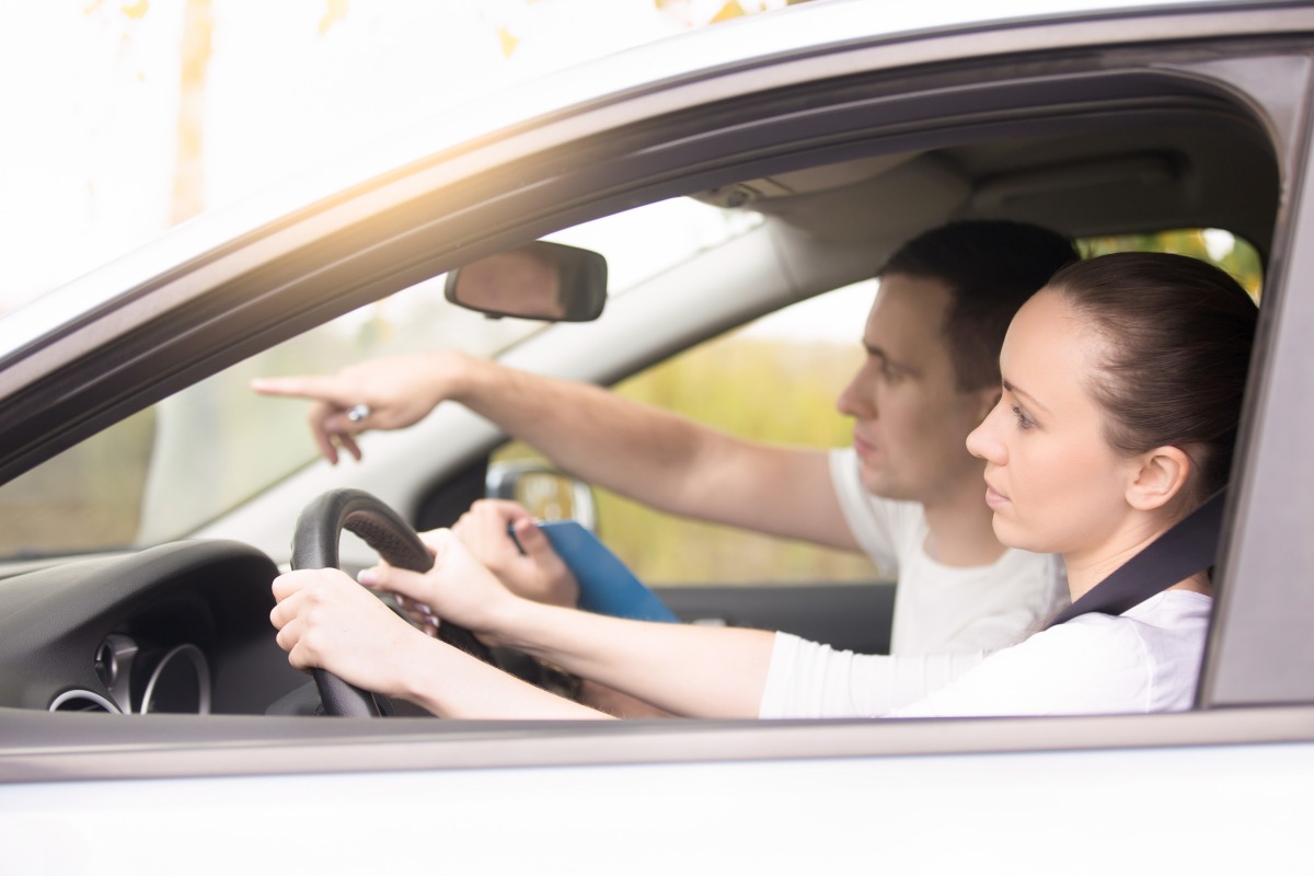 young woman driving man pointing direction https://gonews.com.tw/wp-content/uploads/2025/03/Learners-License__Gonews-_.jpg